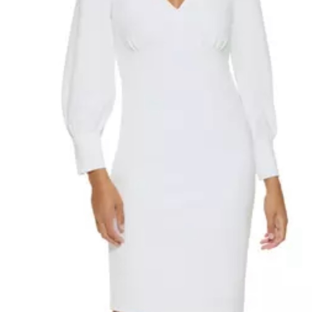 White Dress from Calvin Klein long puff sleeves and deep v neck apron 38”